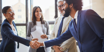 faculty members shaking hands